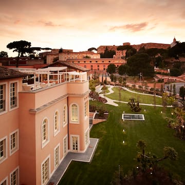 a building with a lawn and a fountain
