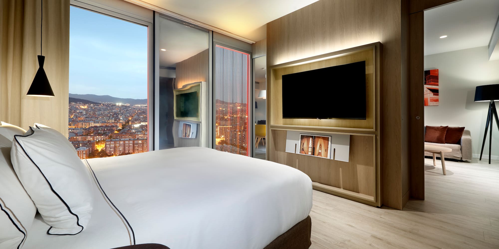 a room with a large television and a large bed