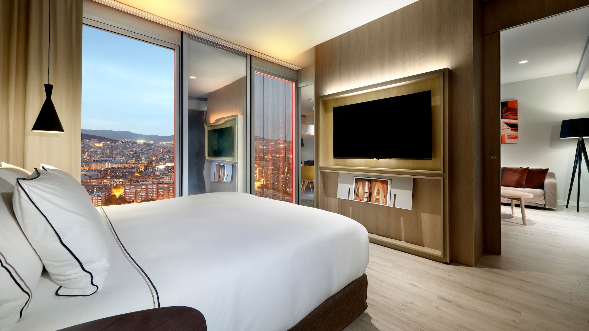 a room with a large television and a large bed