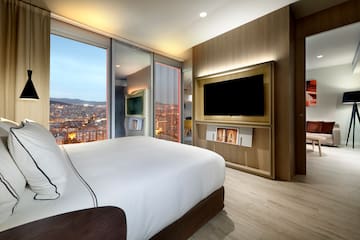 a room with a large television and a large bed