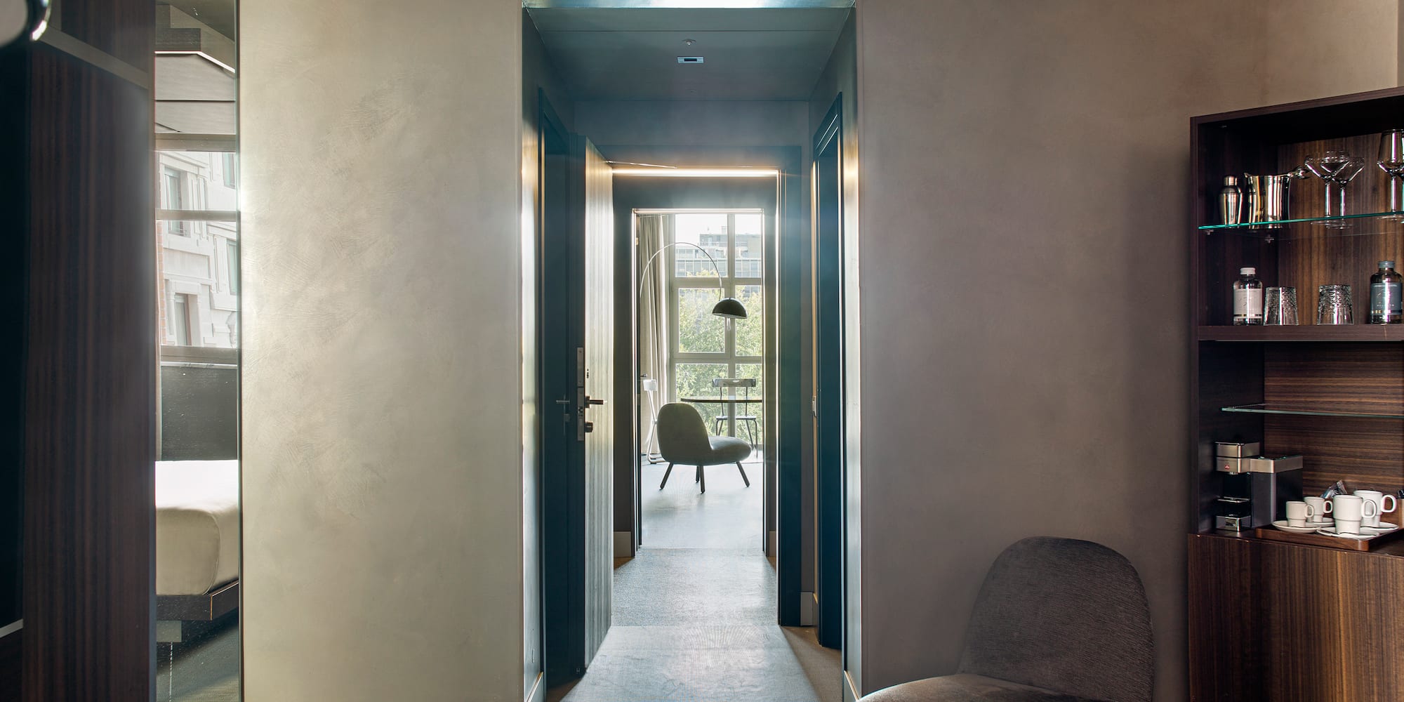 a room with a chair and a bookcase