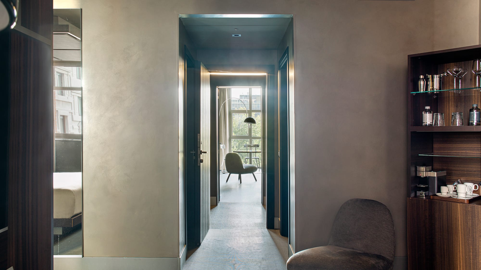 a room with a chair and a bookcase