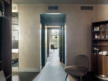a room with a chair and a bookcase