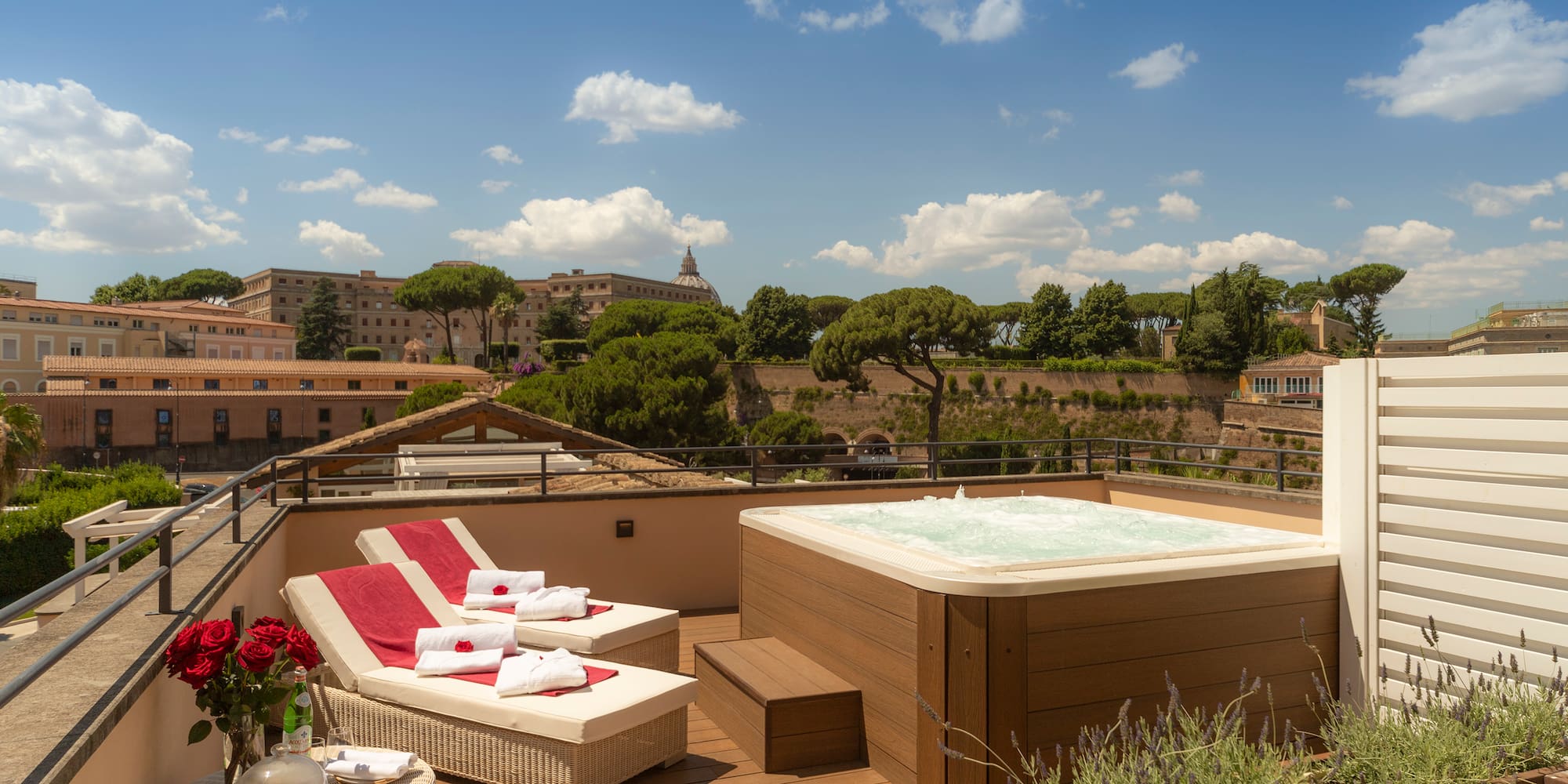 a hot tub on a deck with a view of a city