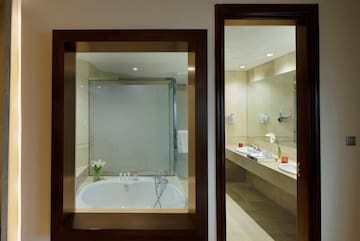 a bathroom with a tub and sinks