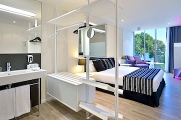 a room with a bed and a mirror