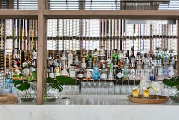 a bar with many bottles of alcohol