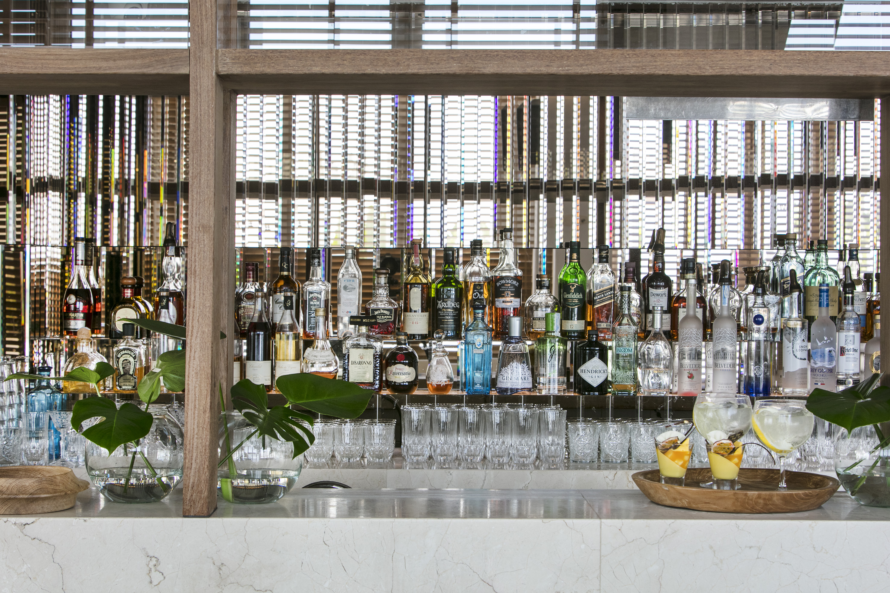 a bar with many bottles of alcohol