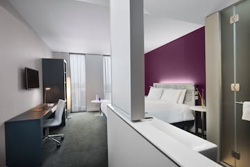 a room with a bed and a desk