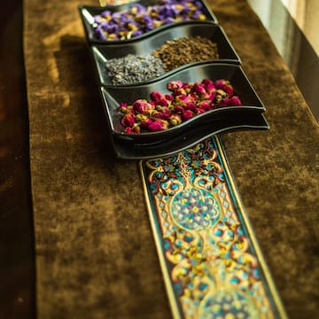 a row of bowls with dried flowers