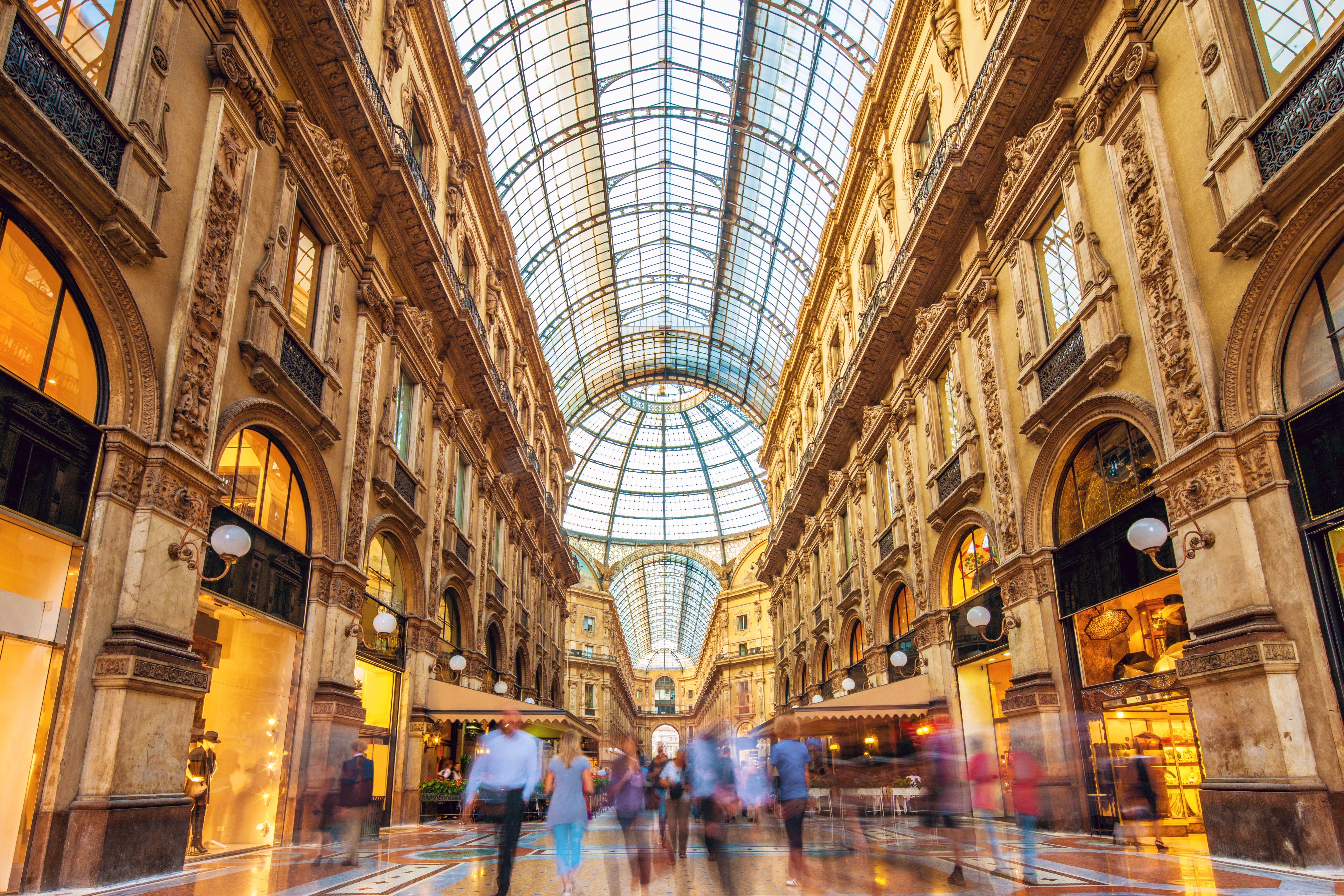 a group of people walking in a shopping mall