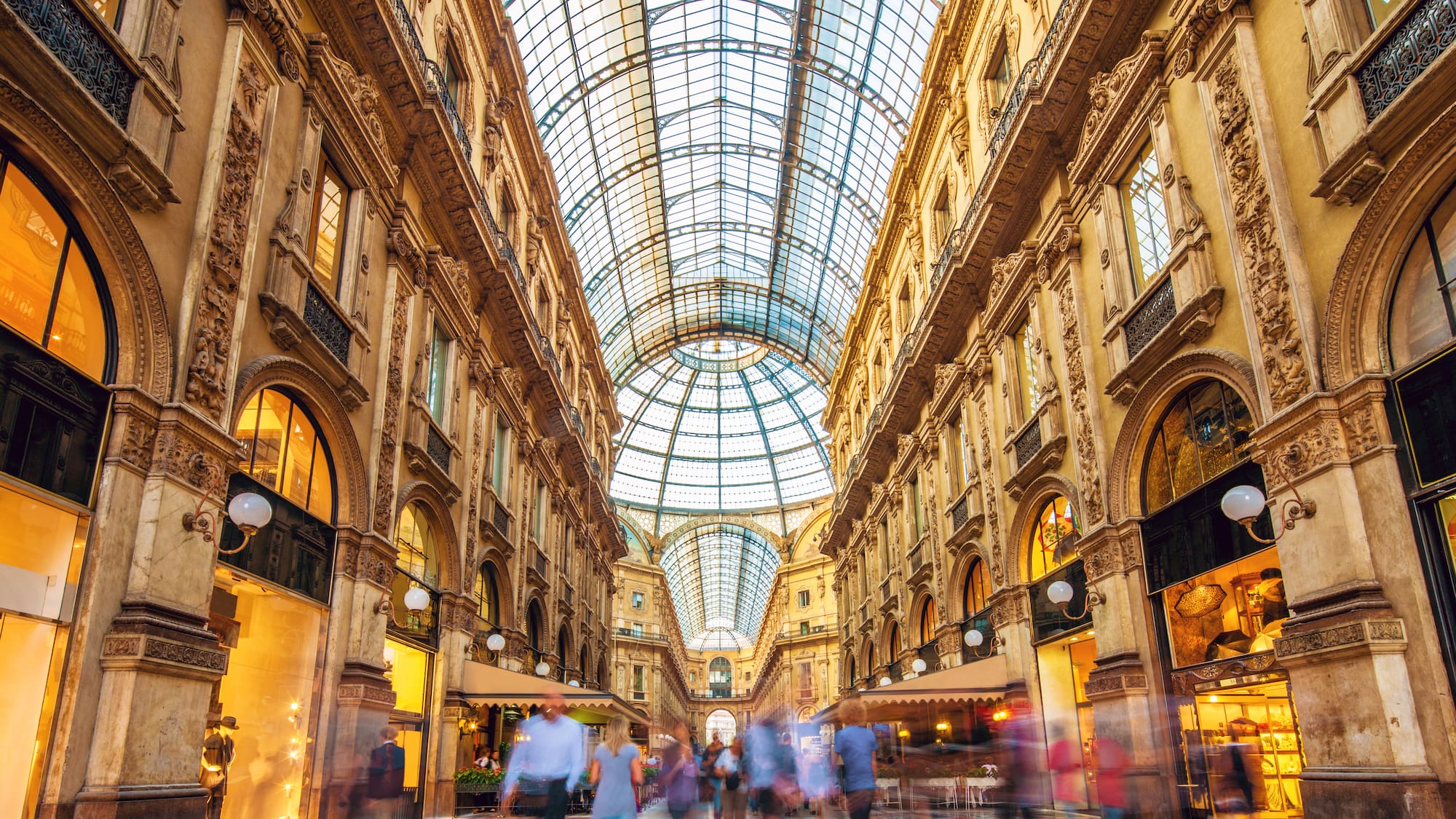 a group of people walking in a shopping mall