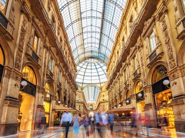 a group of people walking in a shopping mall