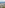 Dense urban skyline nestled within a mountain valley on a cloudy day.