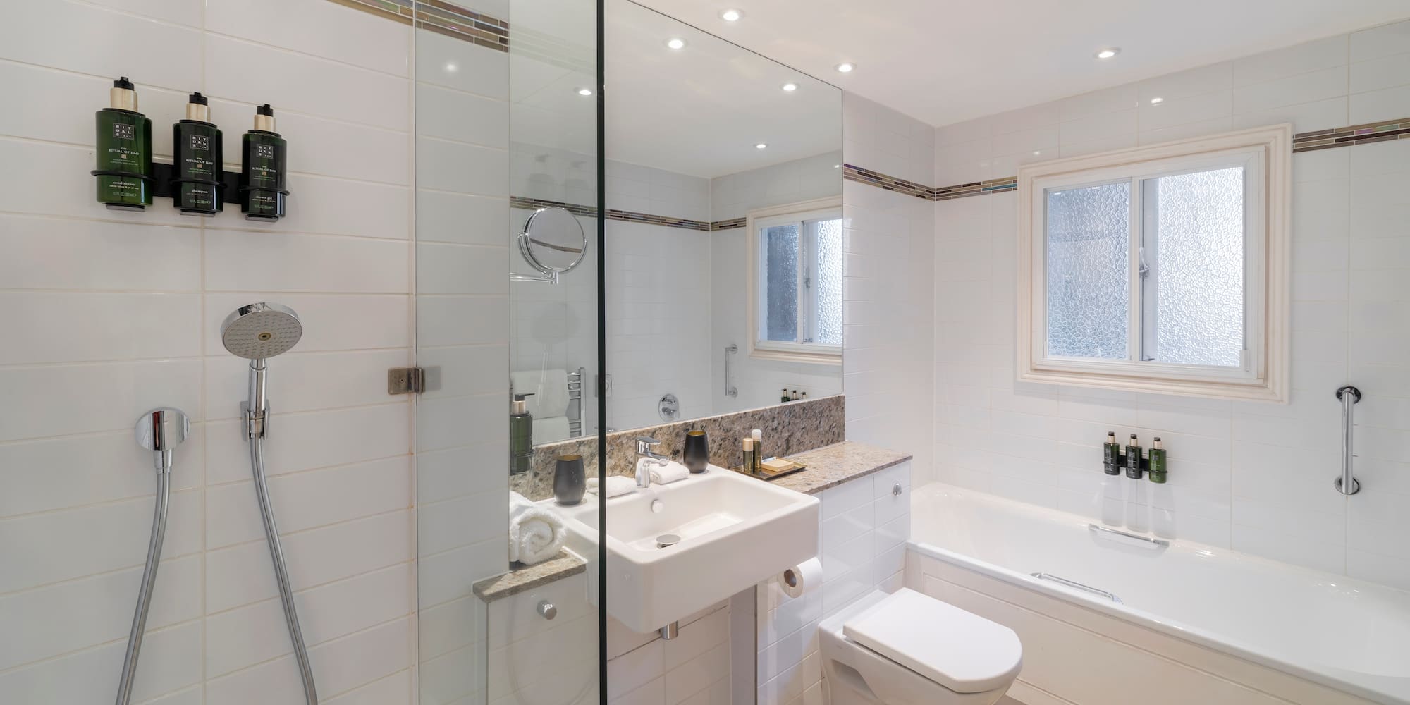 a bathroom with a shower and sink