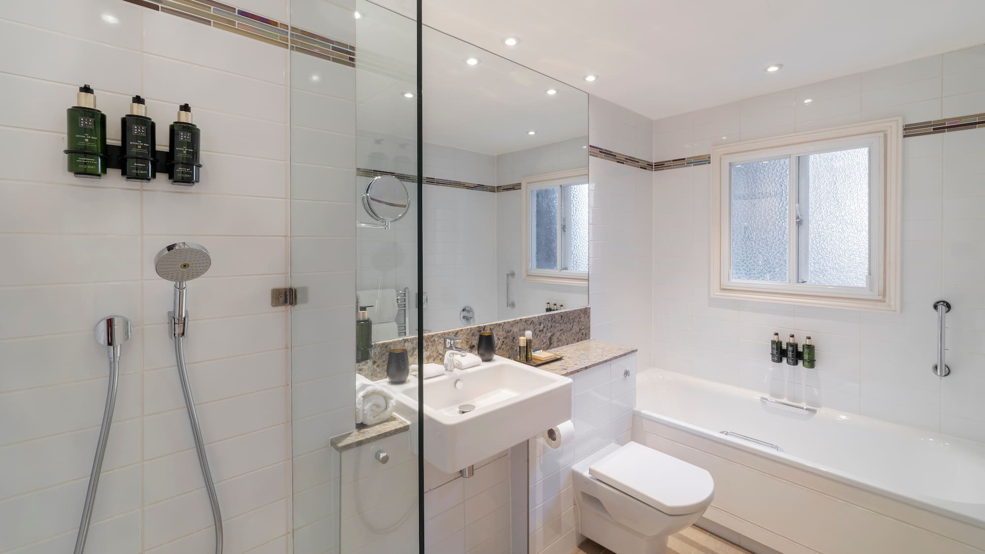 a bathroom with a shower and sink