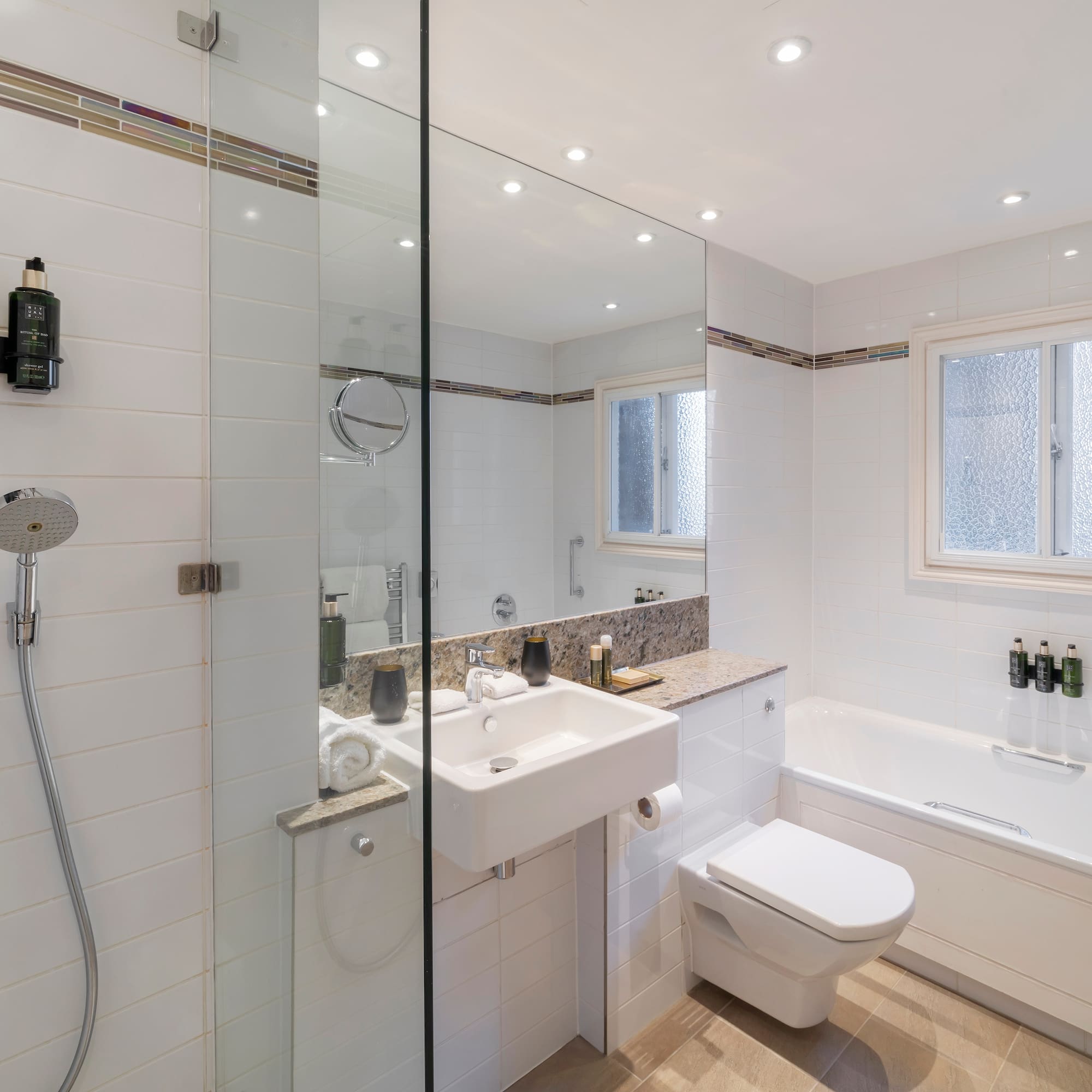 a bathroom with a shower and sink