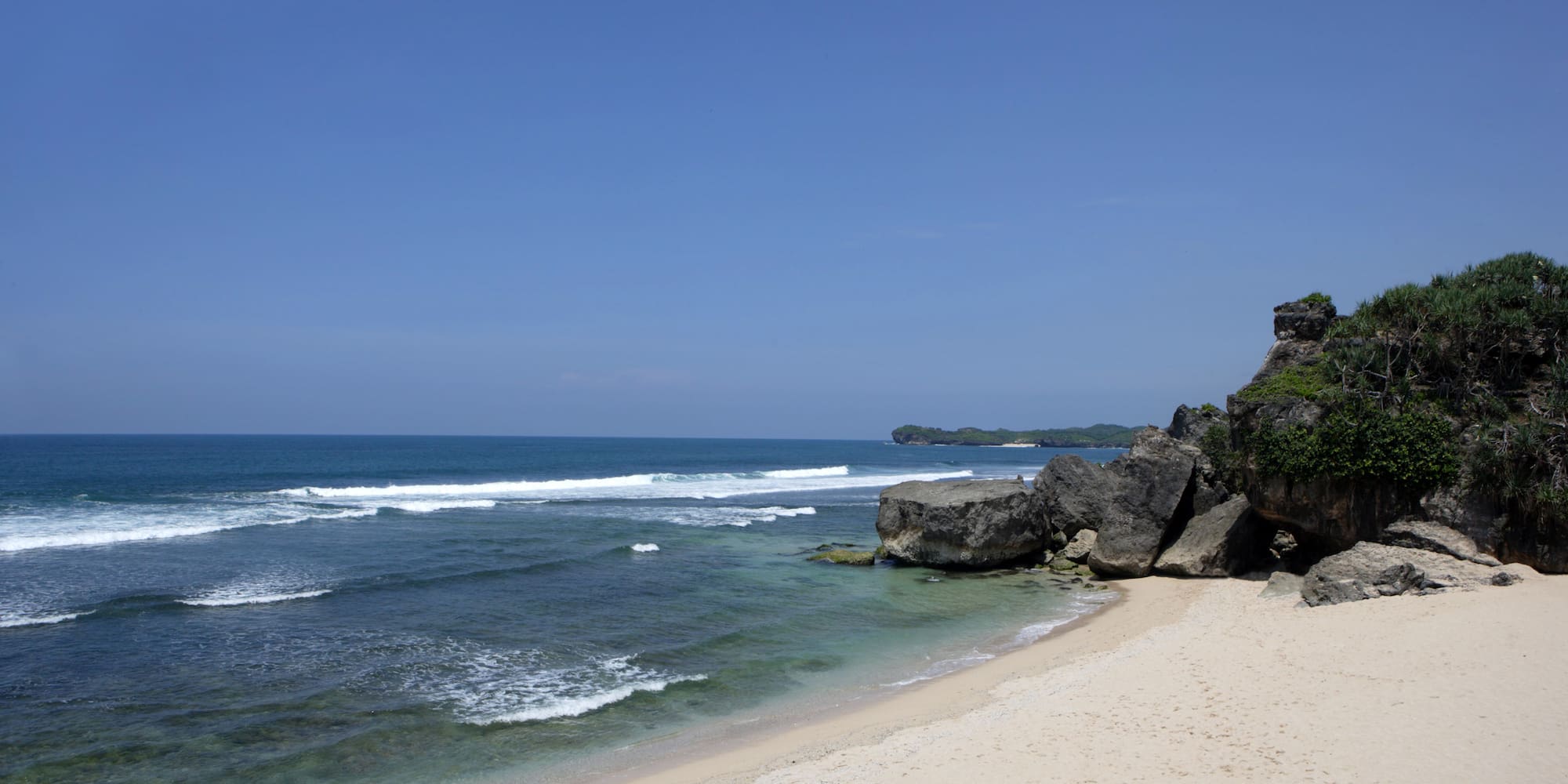 a beach with rocks and water