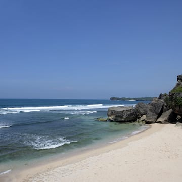 a beach with rocks and water