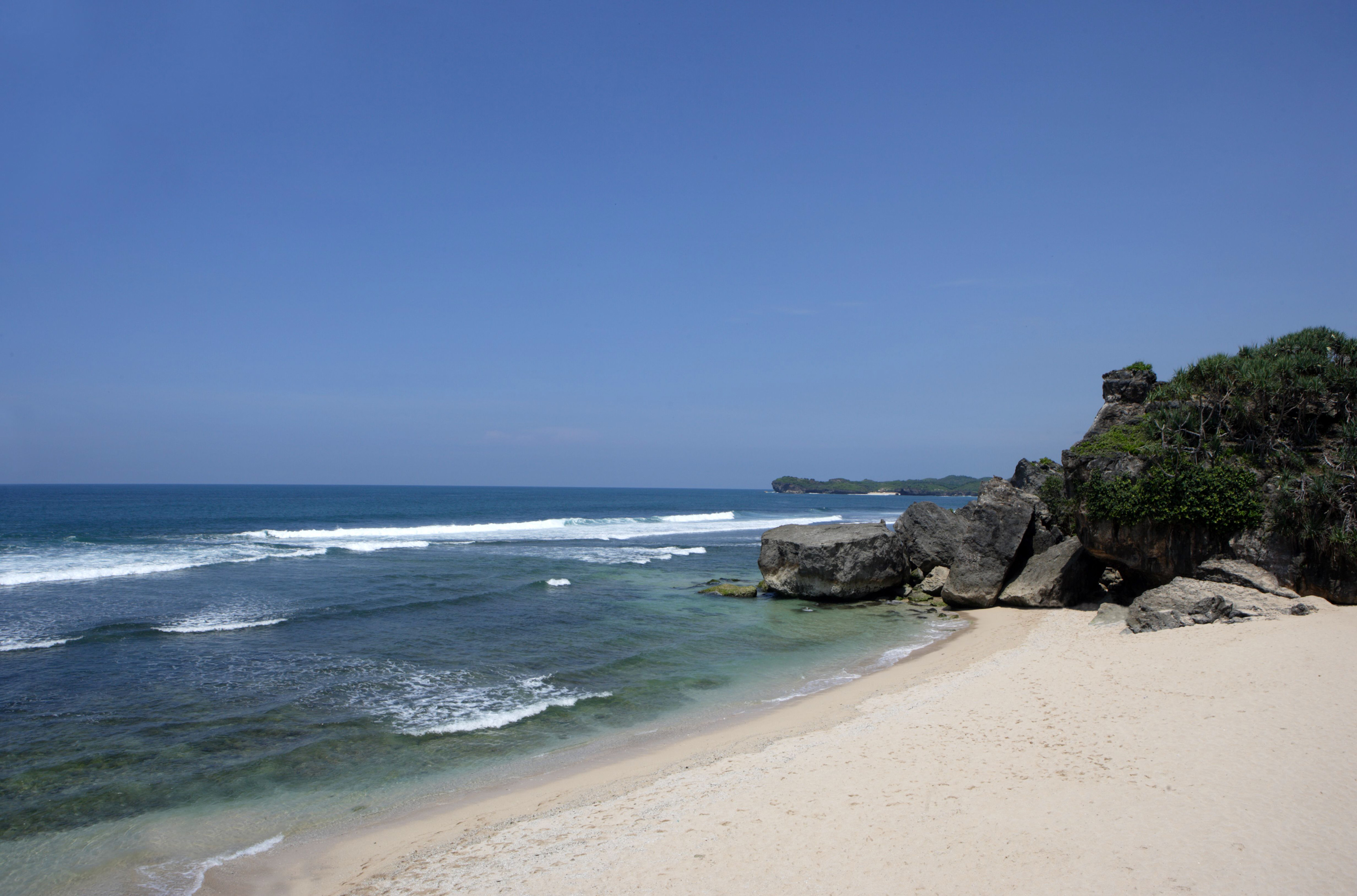 a beach with rocks and water