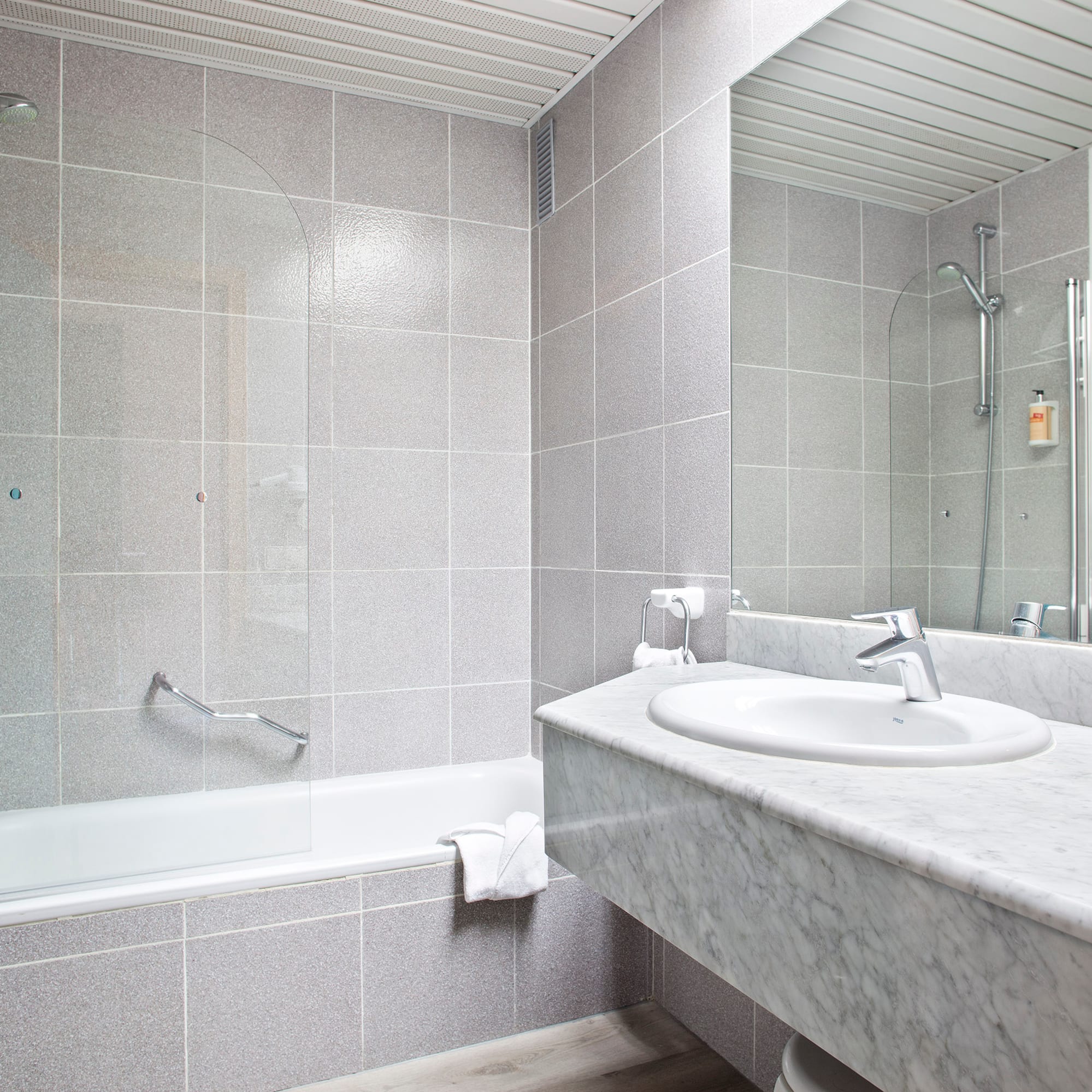 a bathroom with a sink and a shower