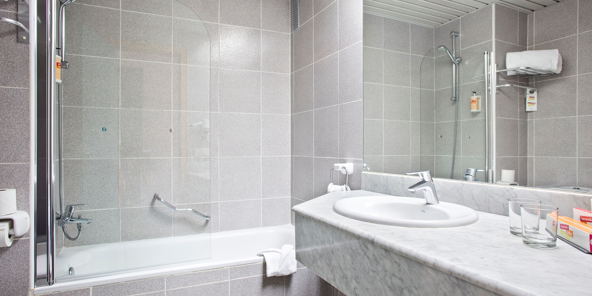 a bathroom with a sink and a shower