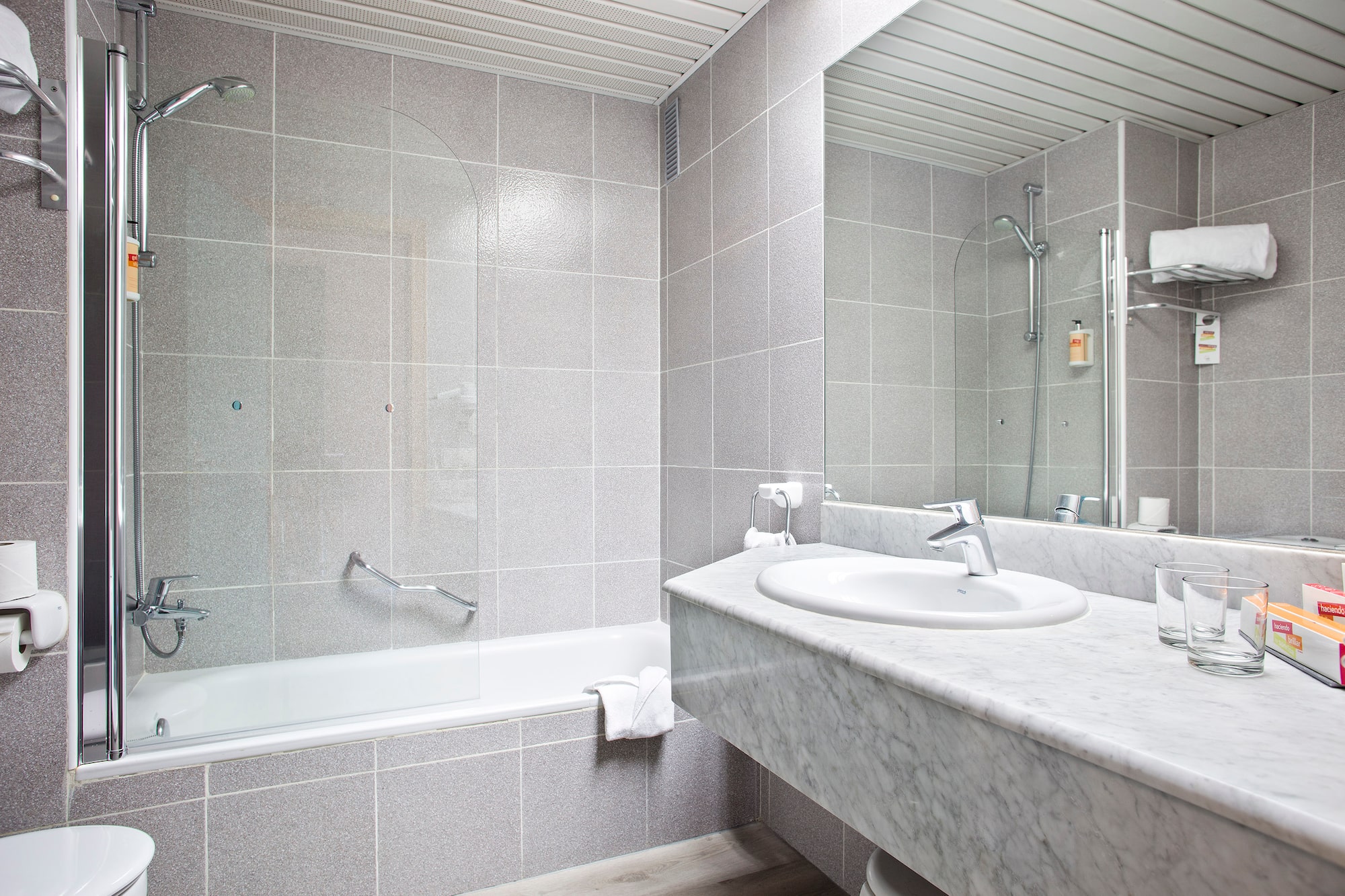 a bathroom with a sink and a shower
