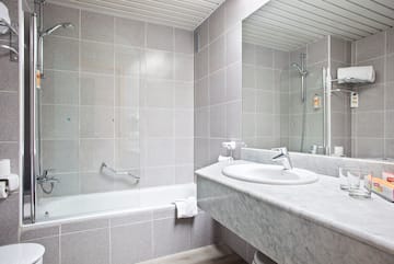 a bathroom with a sink and a shower