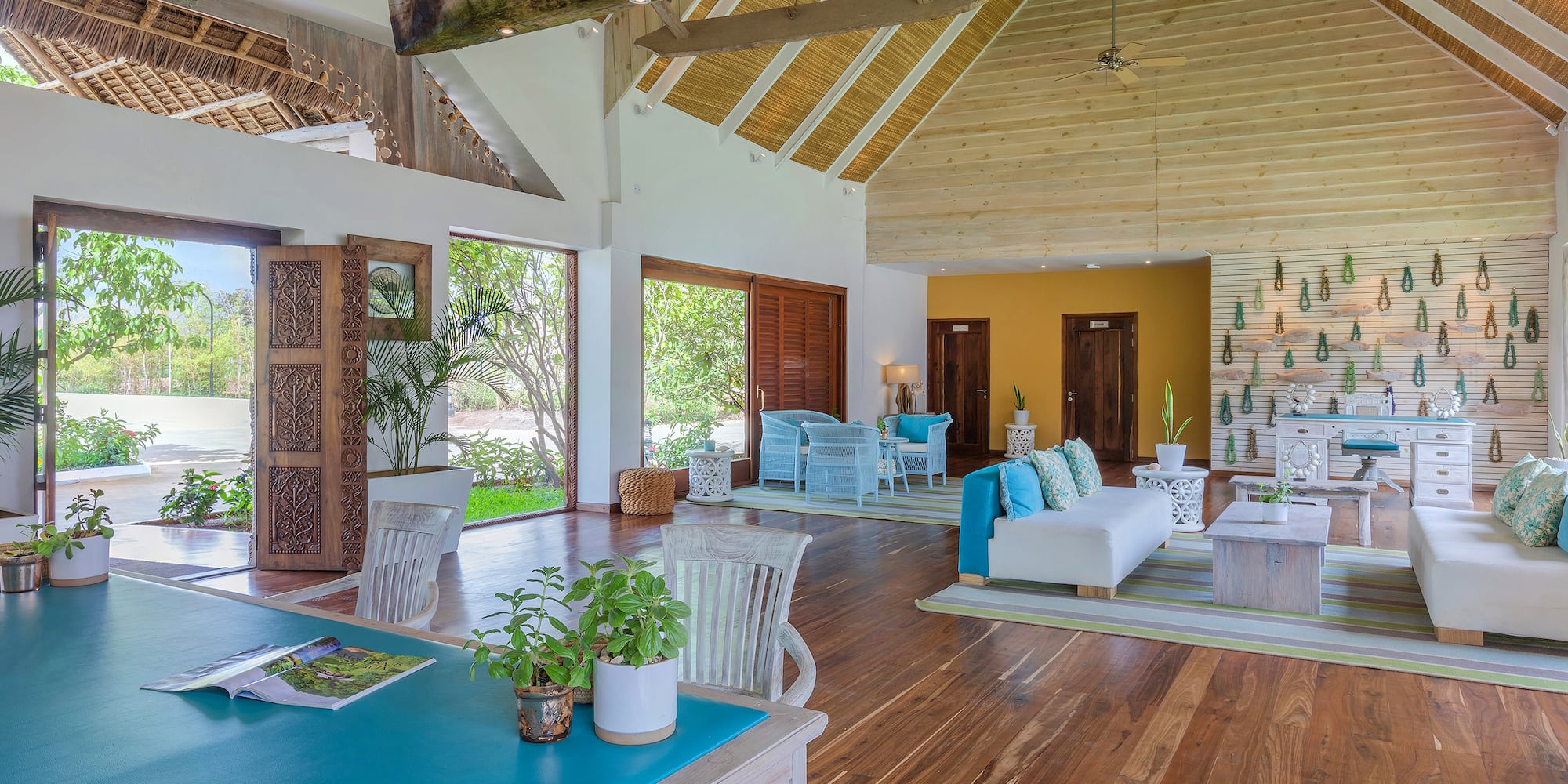 a room with a blue table and chairs