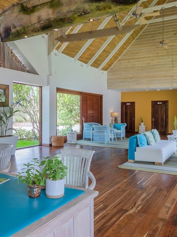 a room with a blue table and chairs