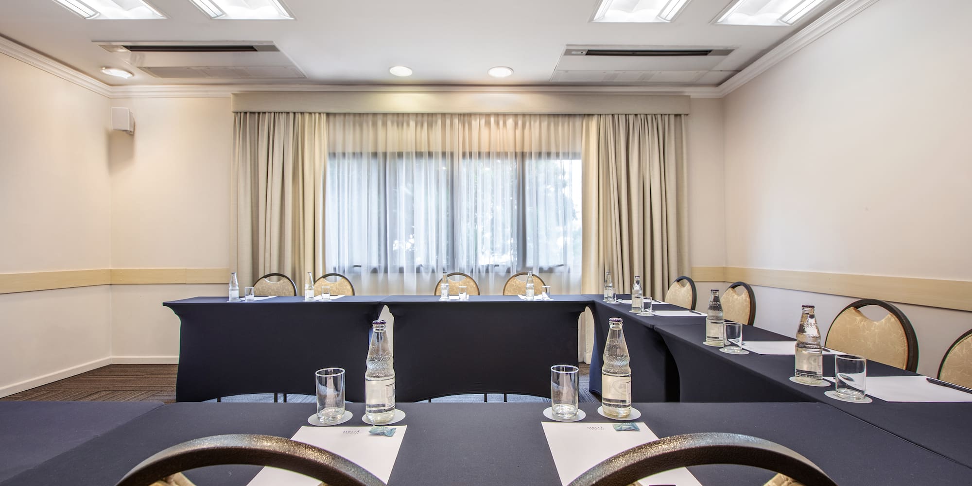 a room with a table and chairs