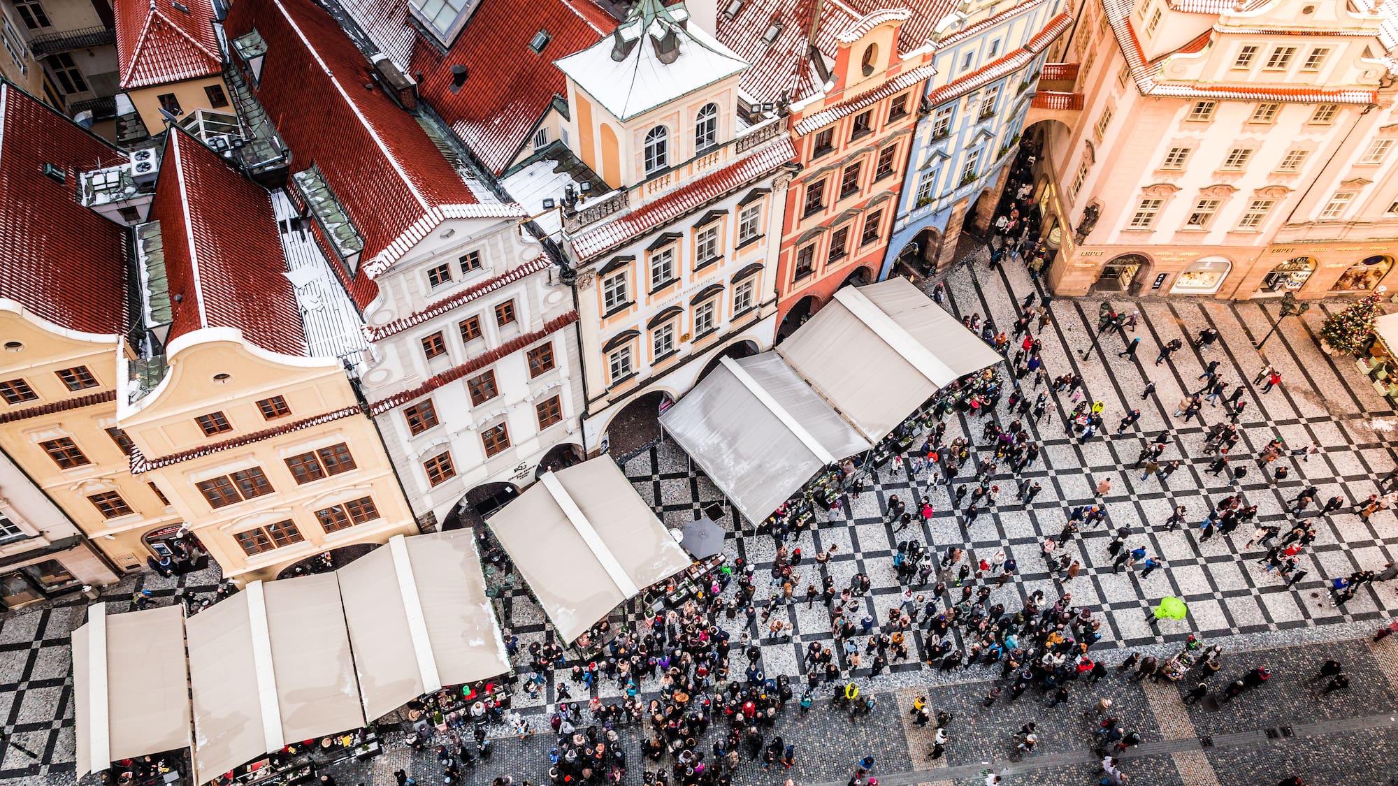 a group of people walking in a city