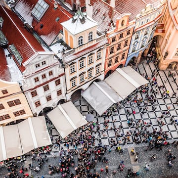 a group of people walking in a city