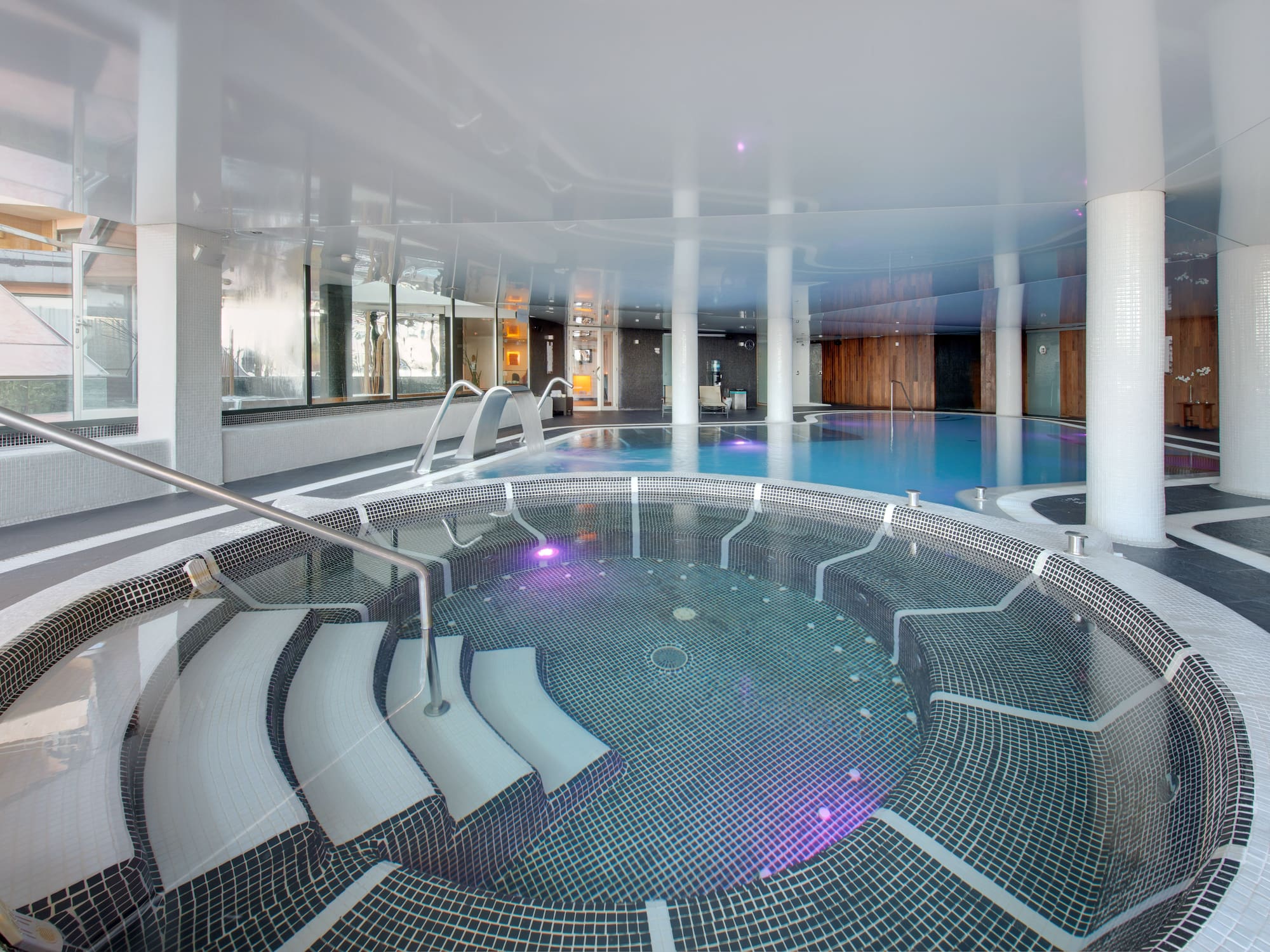 a pool with water pouring out of it