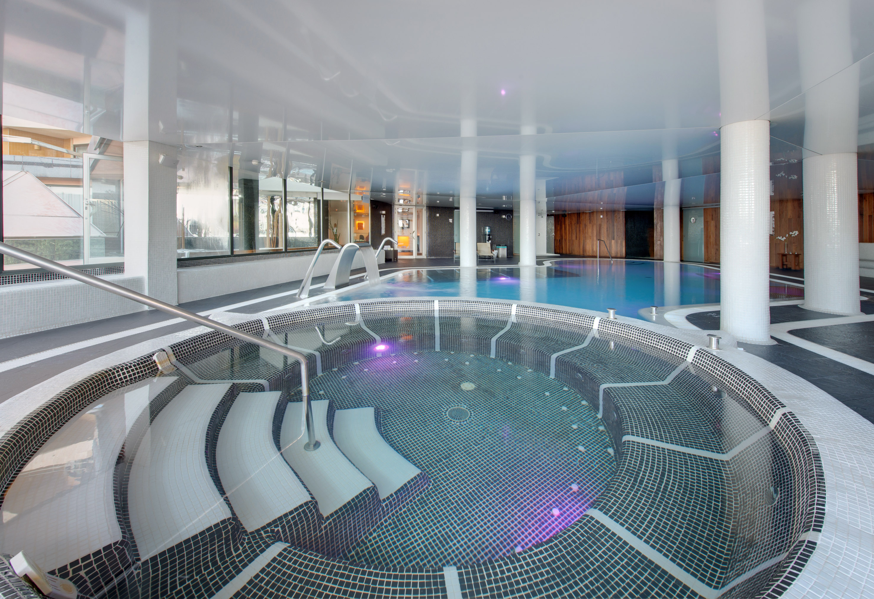 a pool with water pouring out of it