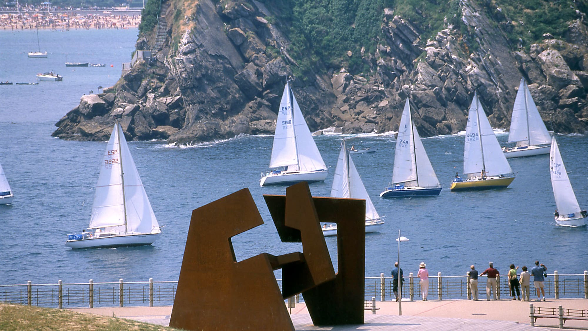 a sculpture of sailboats in the water
