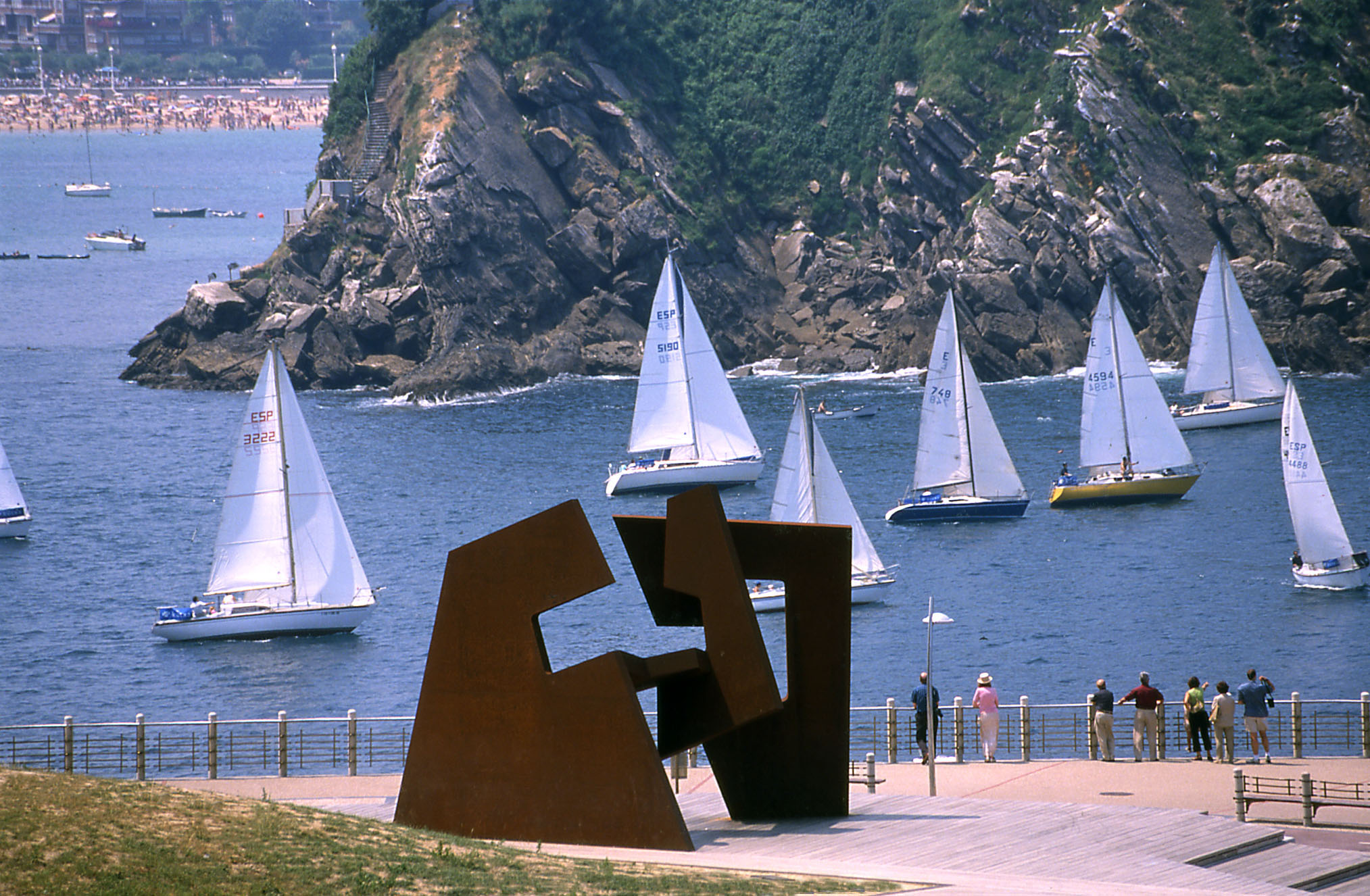a sculpture of sailboats in the water