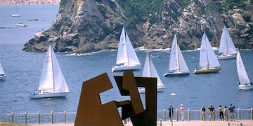 a sculpture of sailboats in the water