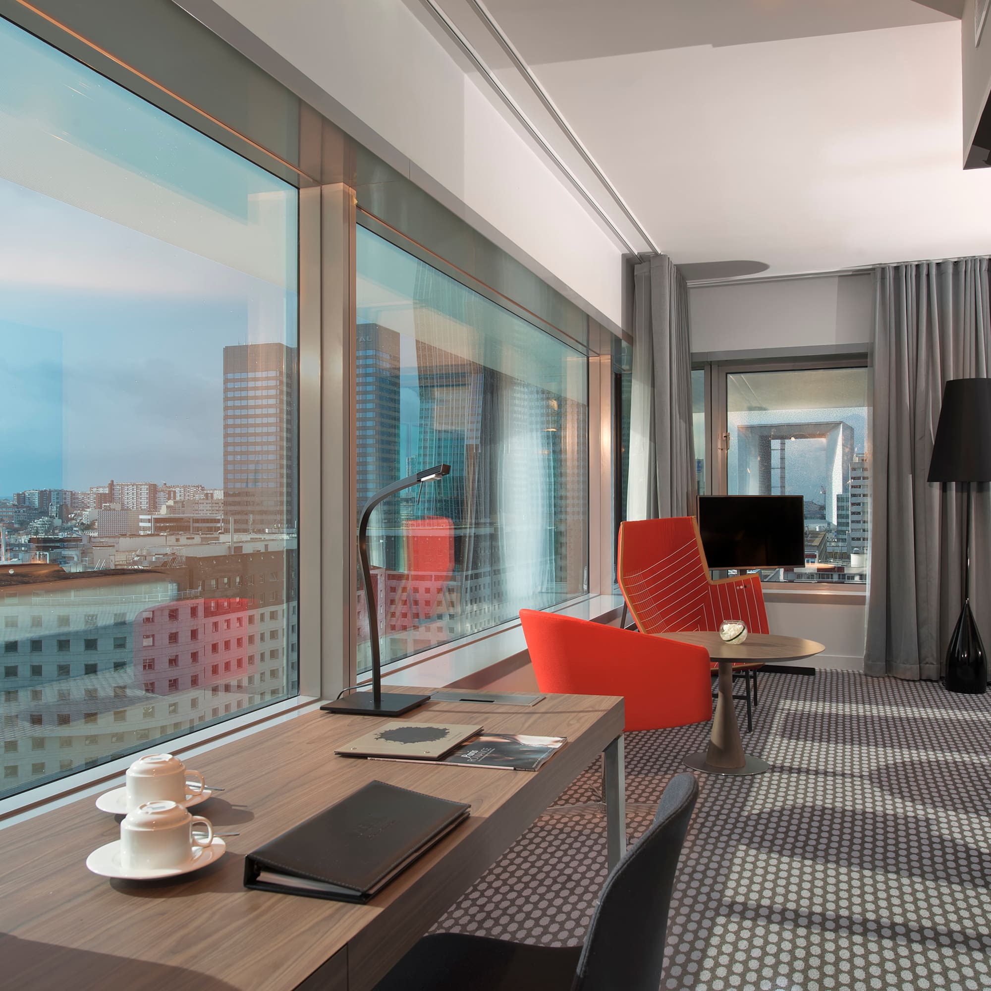 a room with a table and chairs and a window