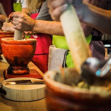 a group of people using mortars