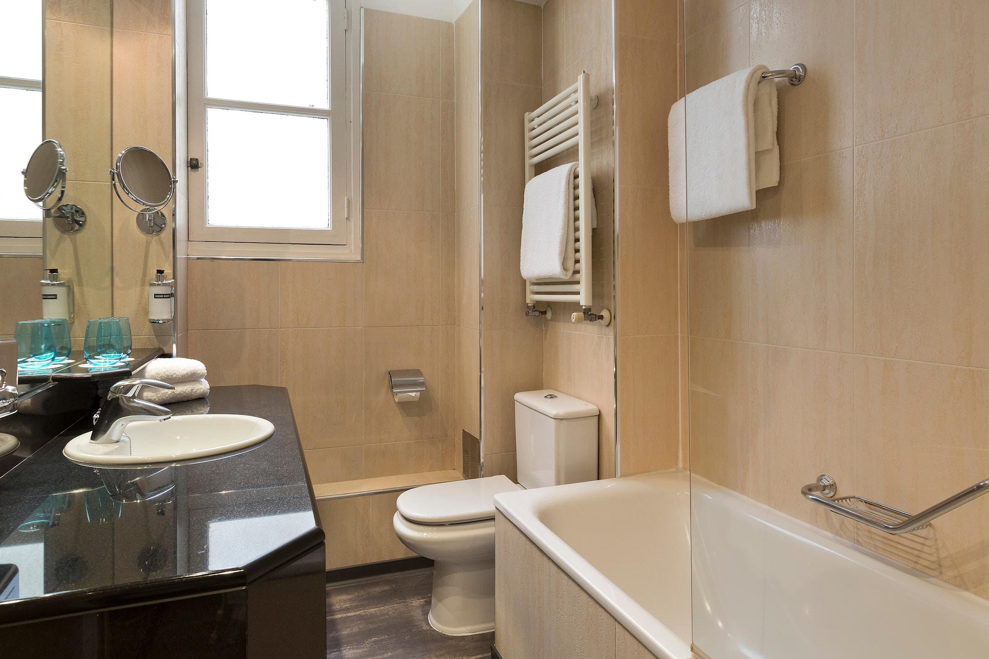 a bathroom with a sink toilet and bathtub