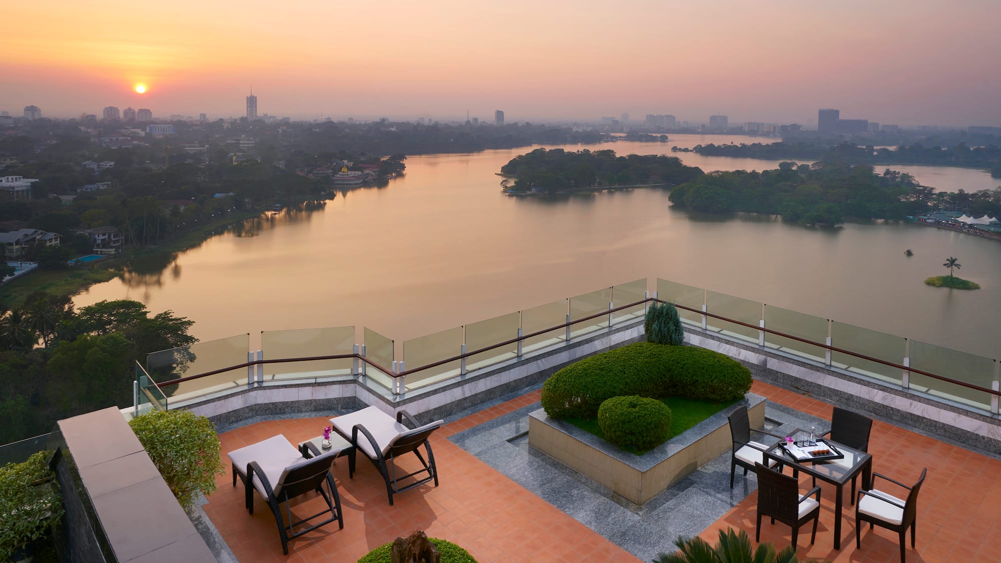 a rooftop patio overlooking a body of water