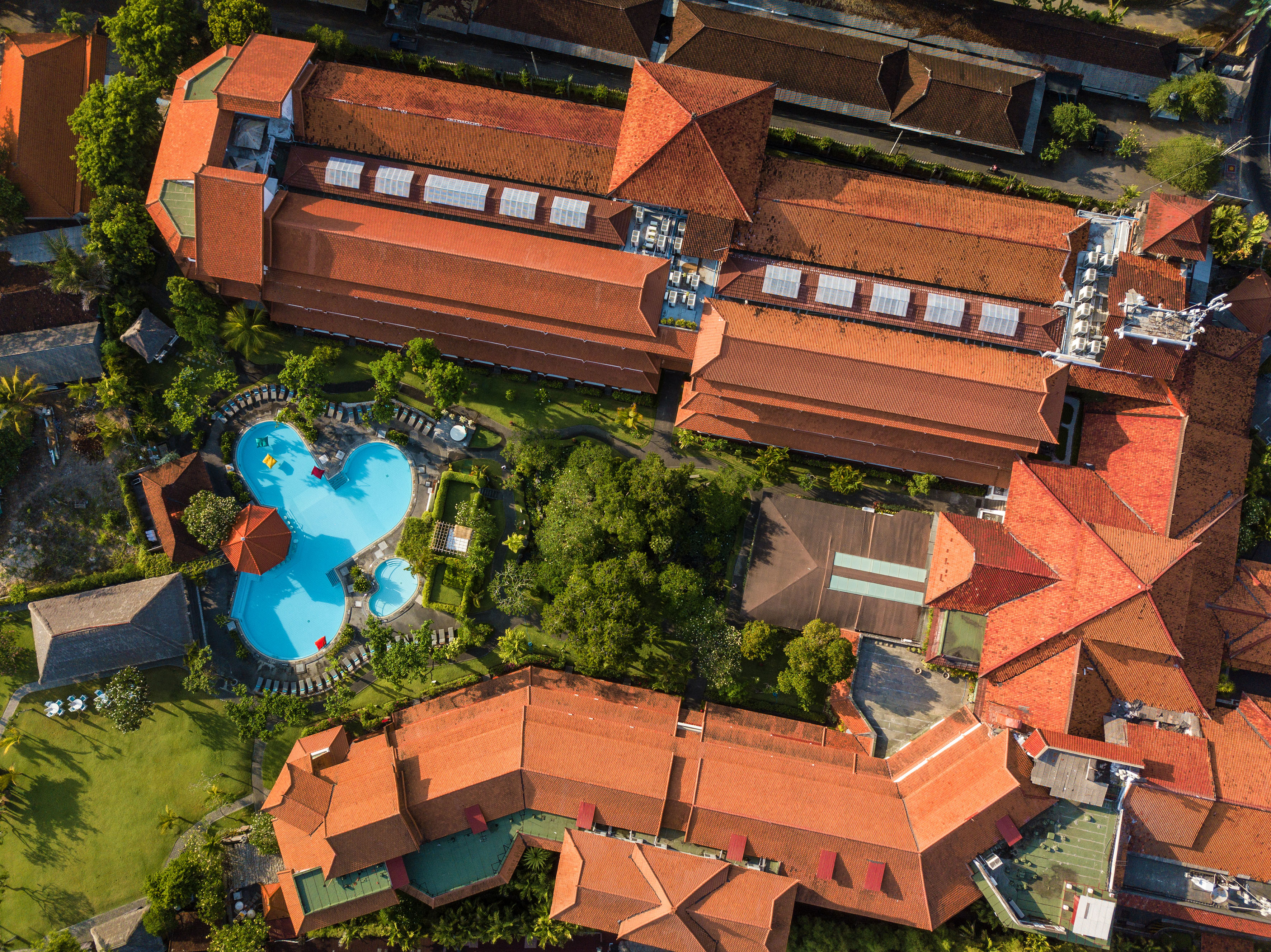 a aerial view of a building with a pool