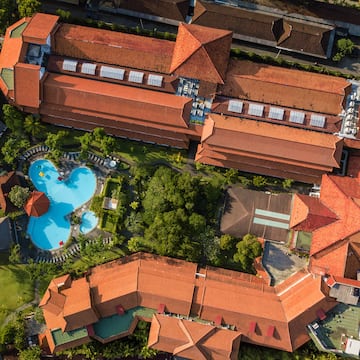 a aerial view of a building with a pool