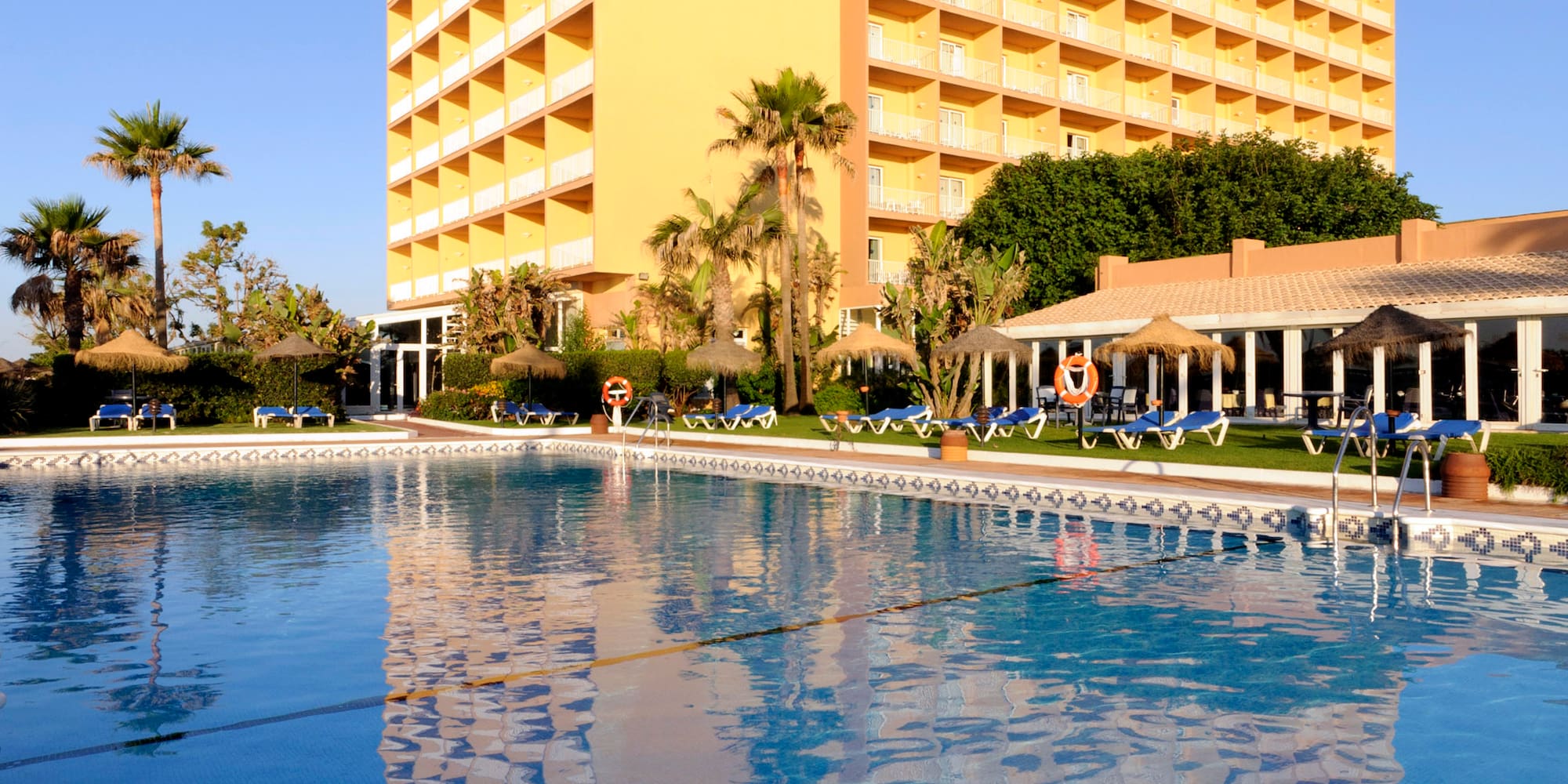 a large building with a pool