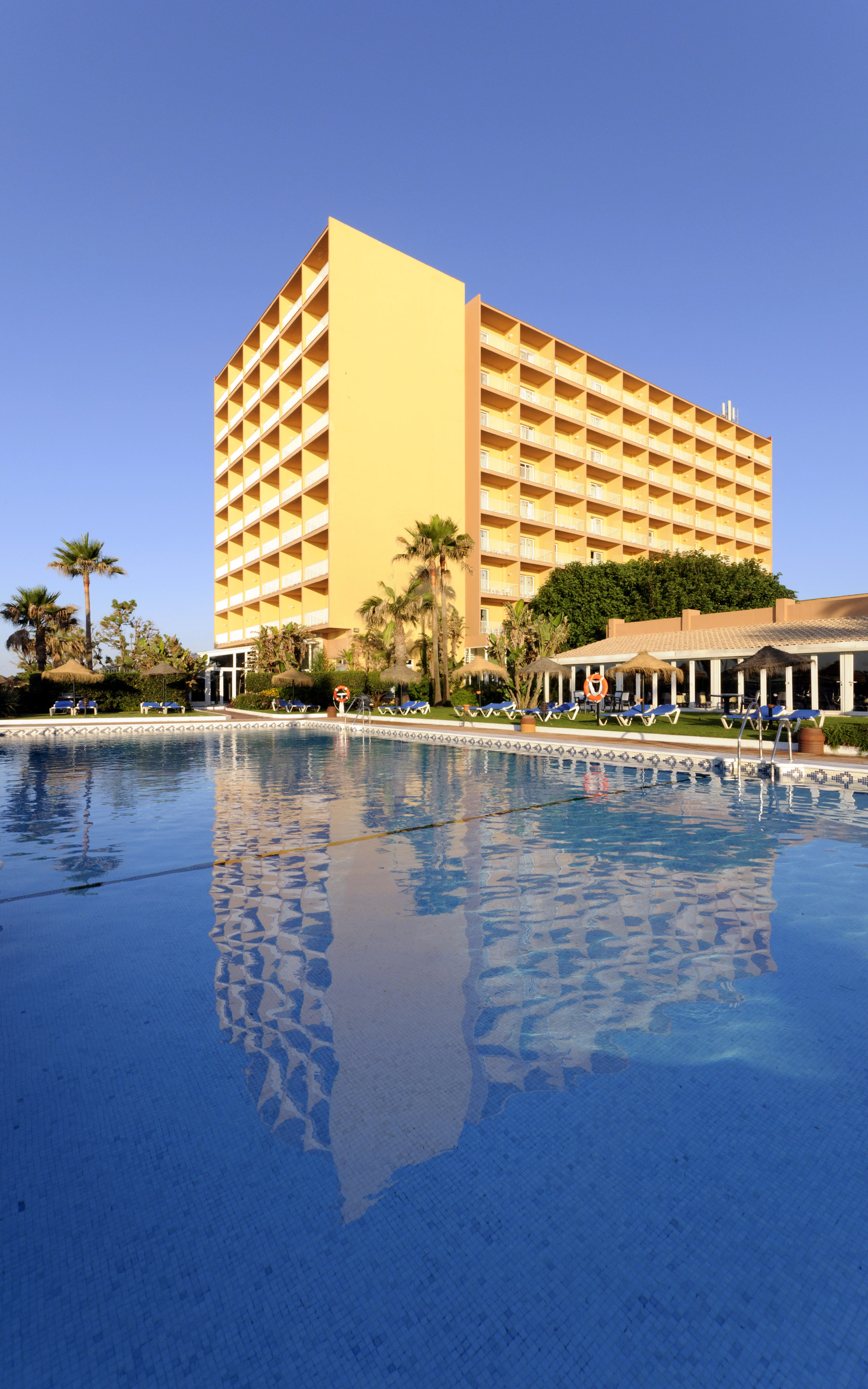 a large building with a pool