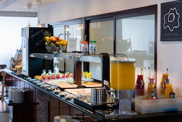 a buffet with fruit and drinks