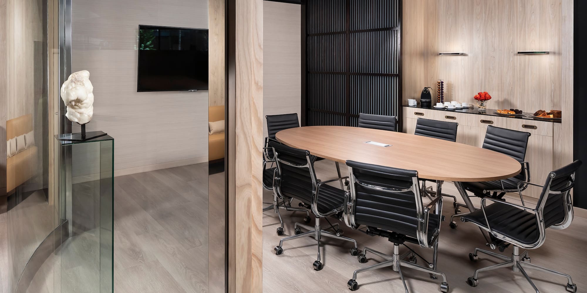 a conference room with a table and chairs