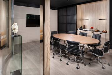 a conference room with a table and chairs