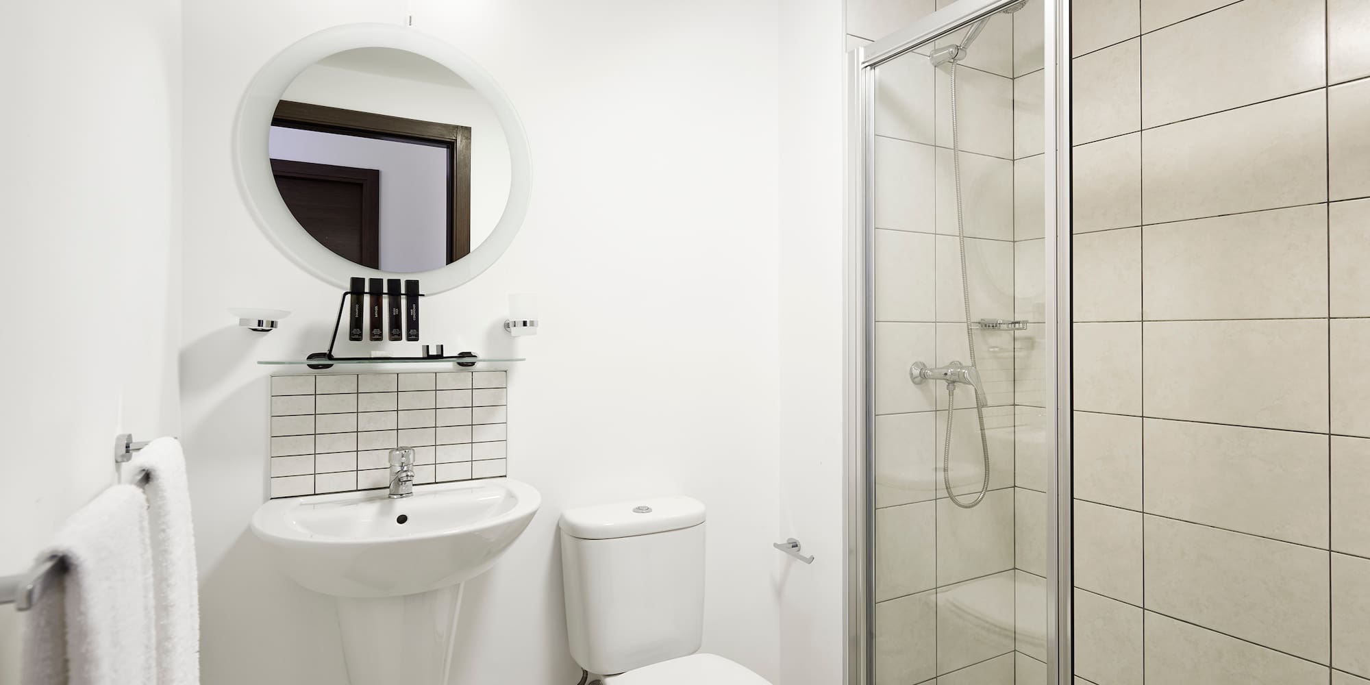a bathroom with a shower and toilet